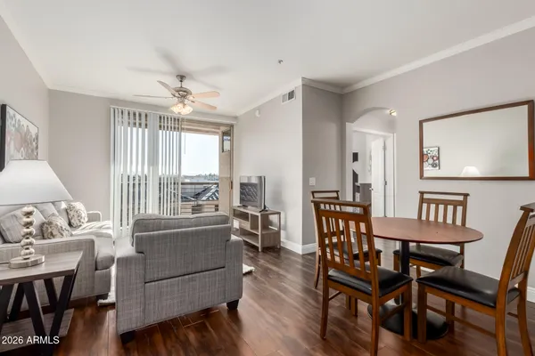 a view of a dining room with furniture window and wooden floor