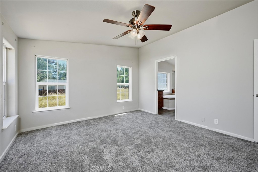 2860 Spring Valley Road Clearlake Oaks, CA 95423 - Photo 20 of 38 an empty room with windows and closet
