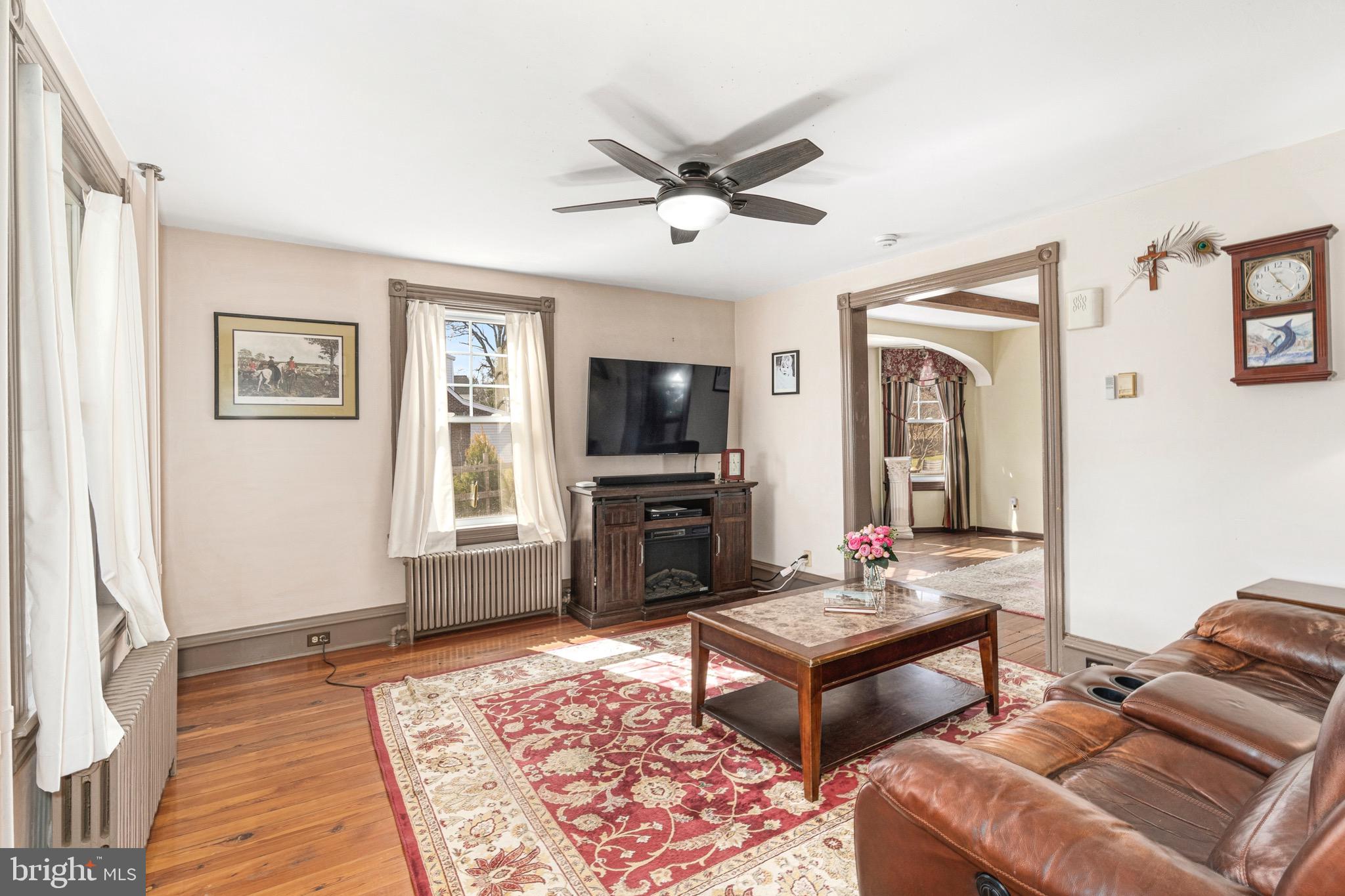 401 Easton Road Riegelsville, PA 18077 - Photo 11 of 27 a living room with furniture and a flat screen tv