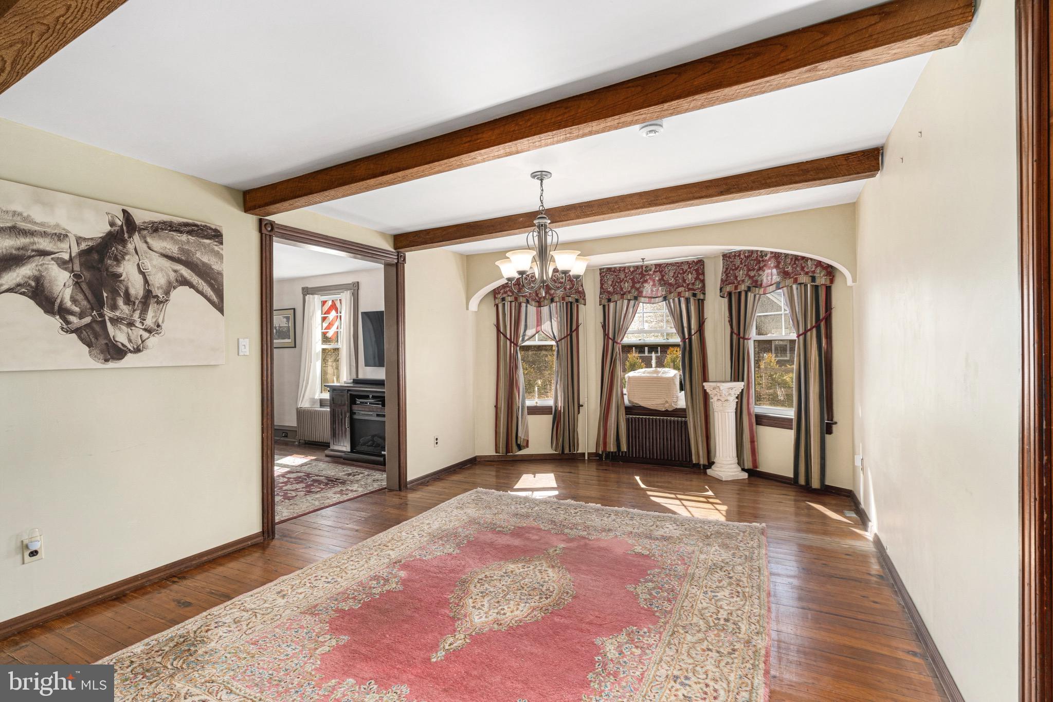 401 Easton Road Riegelsville, PA 18077 - Photo 7 of 27 a view of a hallway with wooden floor and a living room