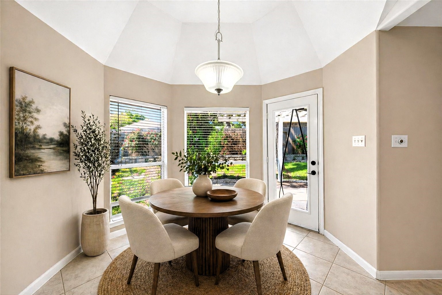 23211 Goldensong Court Spring, TX 77373 - Photo 23 of 50 Breakfast area is a nice size, open and bright with a nice view of the backyard plus the door leading out for entertaining or outdoor grilling. Virtually staged.