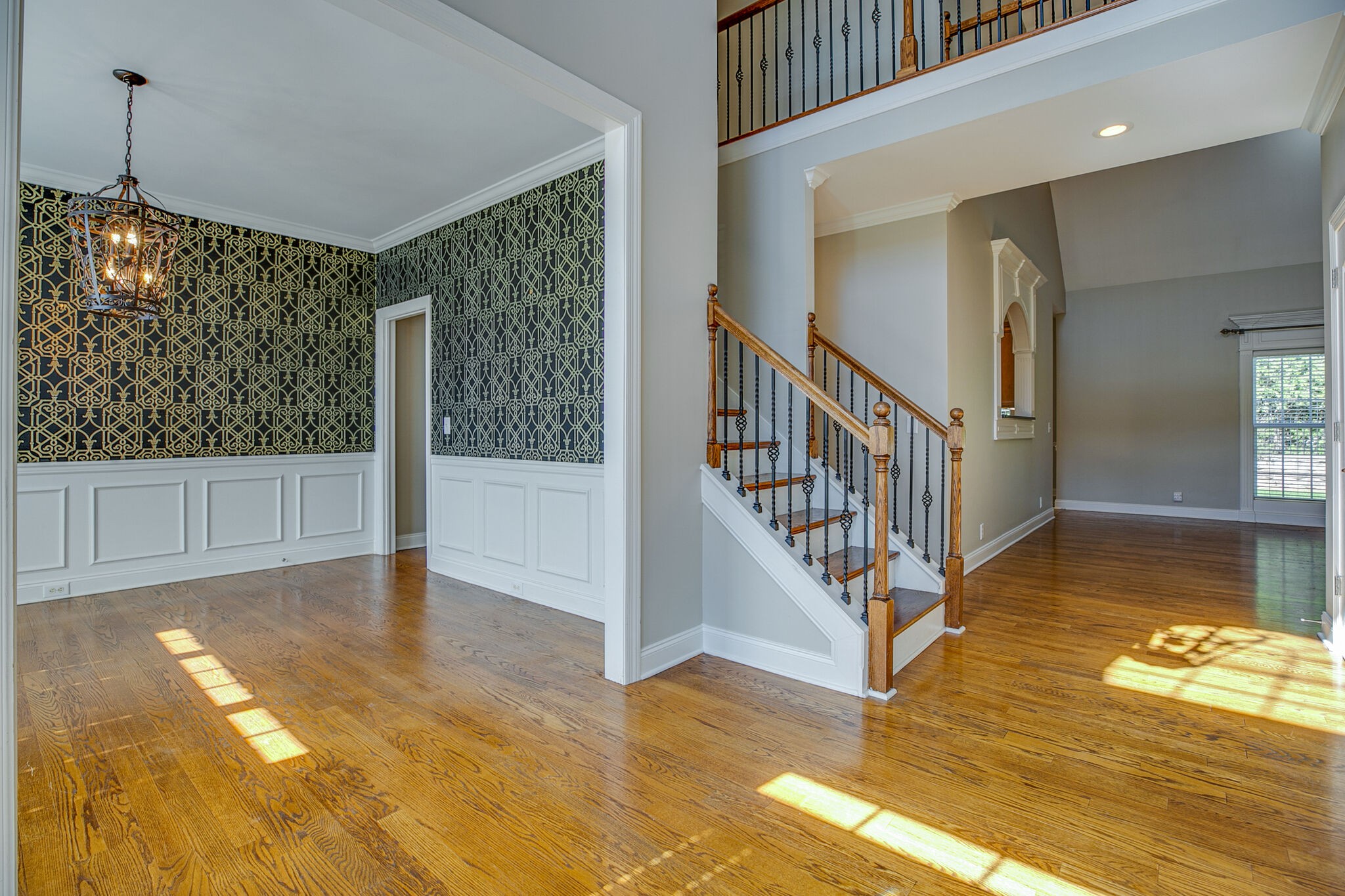 1907 Splash Place Murfreesboro, TN 37130 - Photo 8 of 40 a view of an entryway with wooden floor mirror and a chandelier
