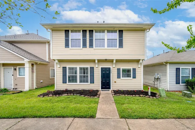 front view of a house with a yard