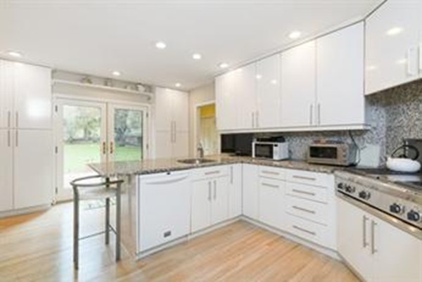 101 Stuart Road Newton, MA 02459 - Photo 11 of 26 a kitchen with a sink stove and cabinets