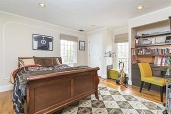 101 Stuart Road Newton, MA 02459 - Photo 20 of 26 a bedroom with a bed and wooden floor