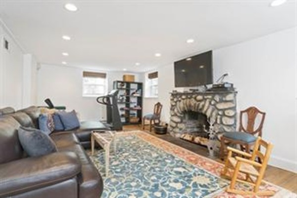 101 Stuart Road Newton, MA 02459 - Photo 24 of 26 a living room with furniture and a flat screen tv