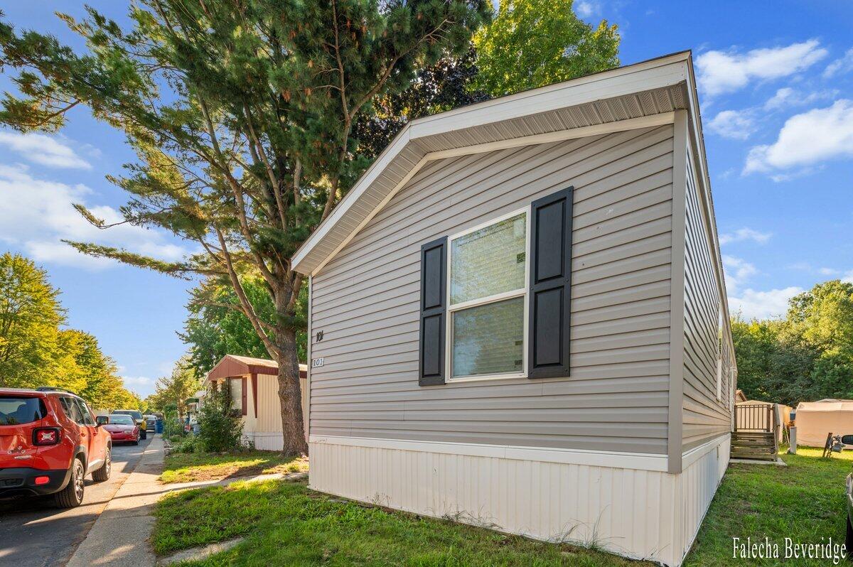 1281 East Pontaluna Road, Unit 101 Spring Lake, MI 49456 - Photo 3 of 18 EXTERIOR 04A-2