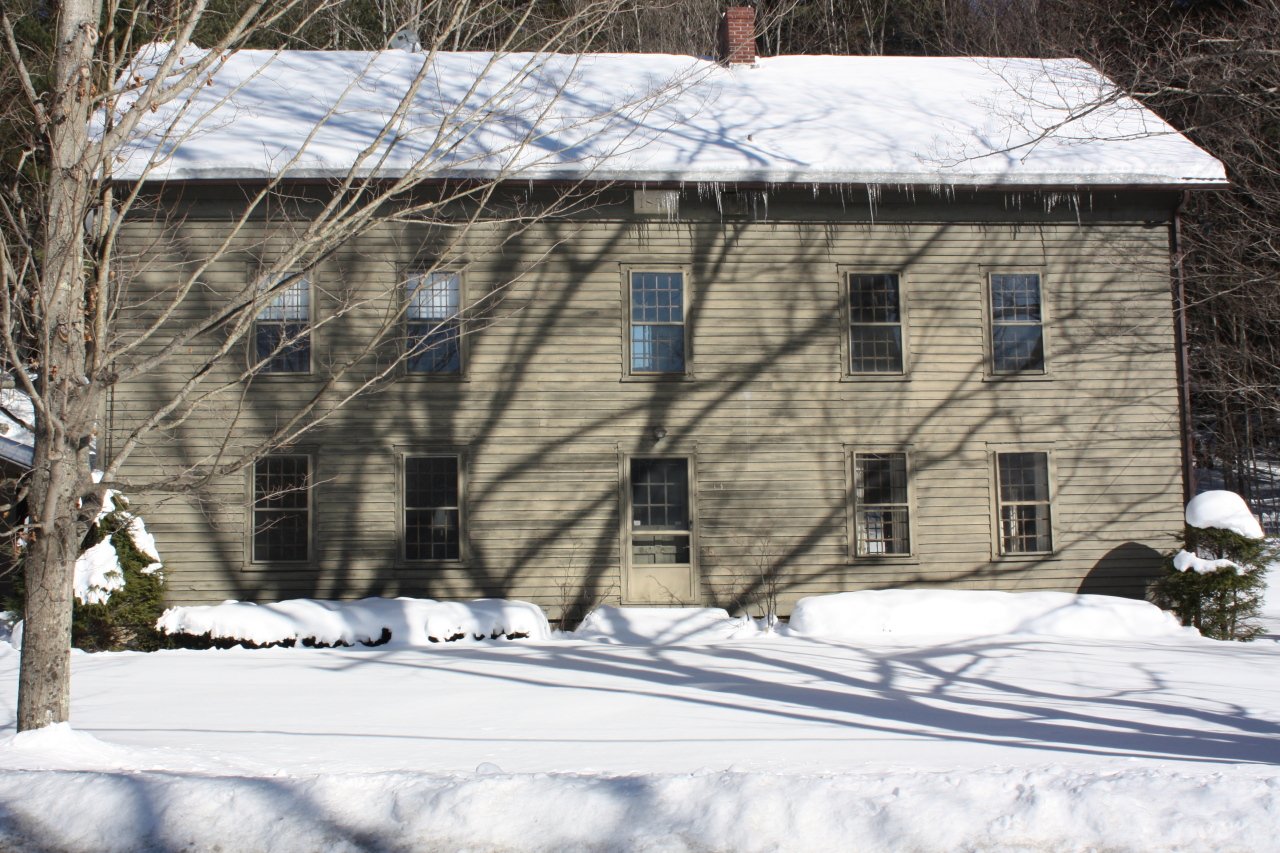 13 Main Road Tyringham, MA 01238 - Photo 1 of 31 a brick building with a bench in front of it