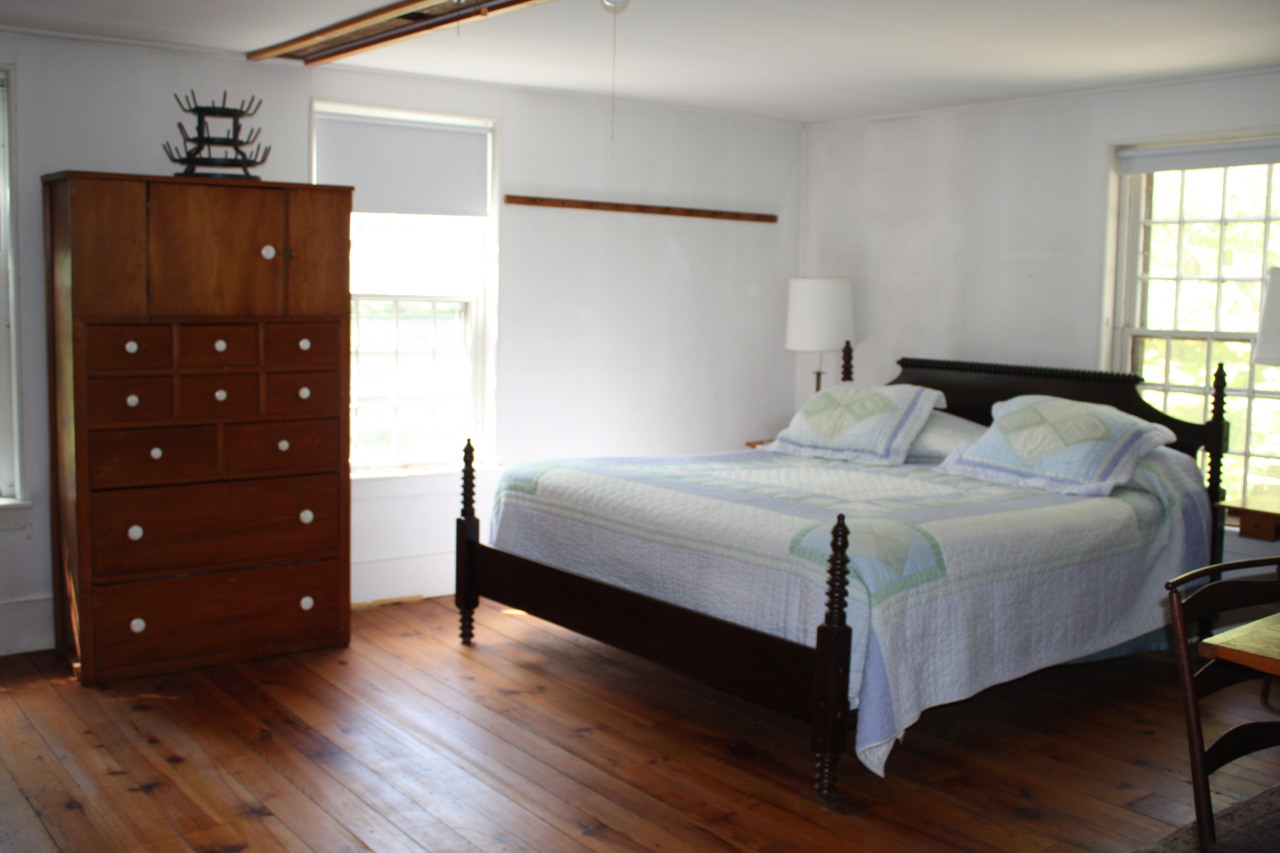 13 Main Road Tyringham, MA 01238 - Photo 19 of 31 a bedroom with a bed and a closet