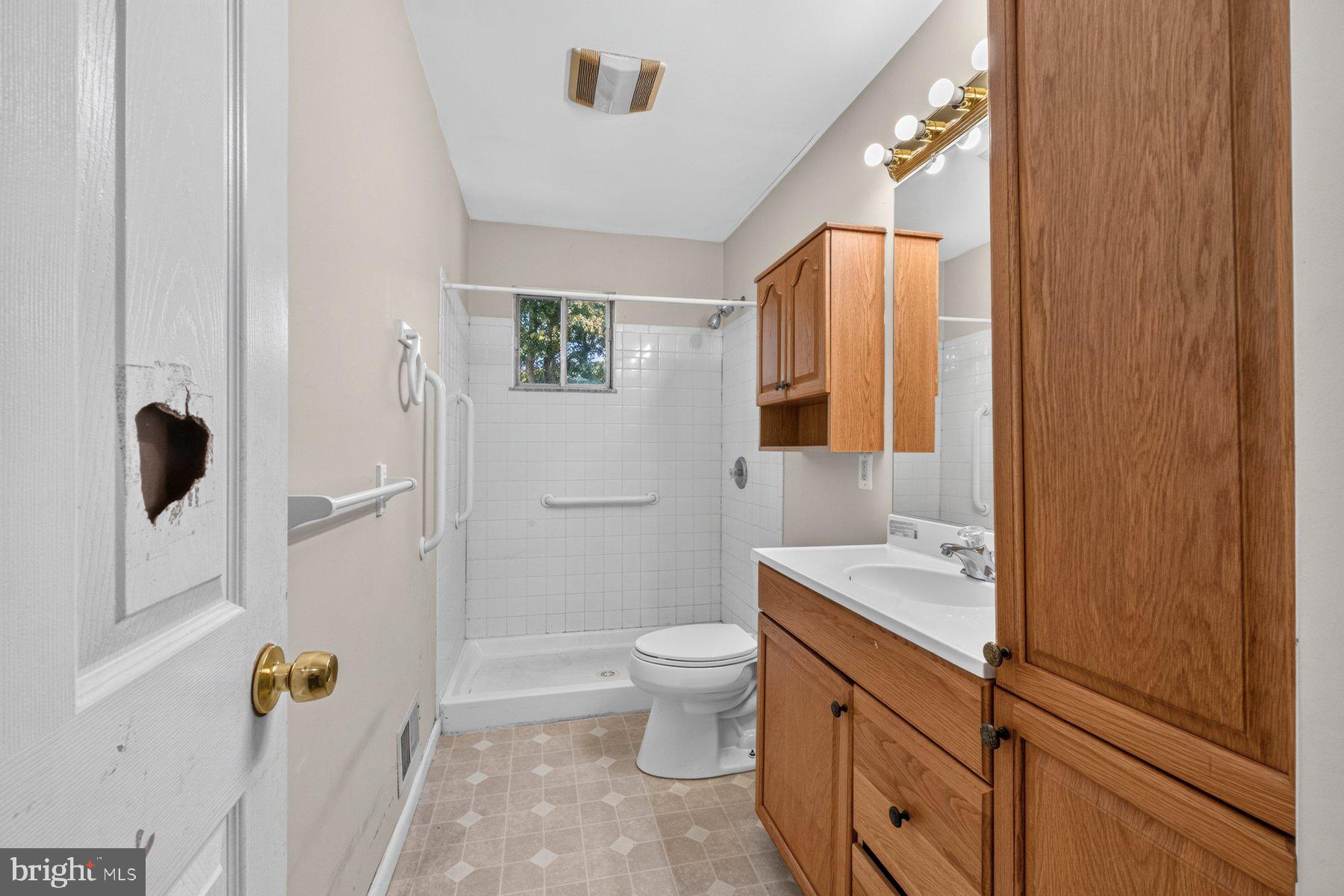 7738 Notley Road Pasadena, MD 21122 - Photo 11 of 25 Bright and functional bathroom space.