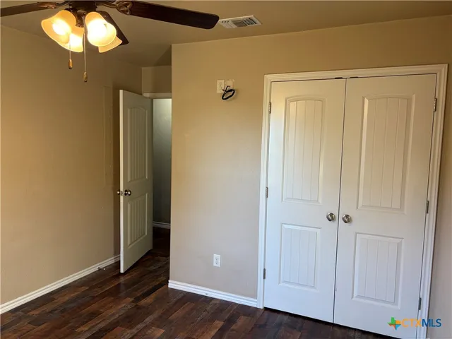 a view of an entryway with wooden floor