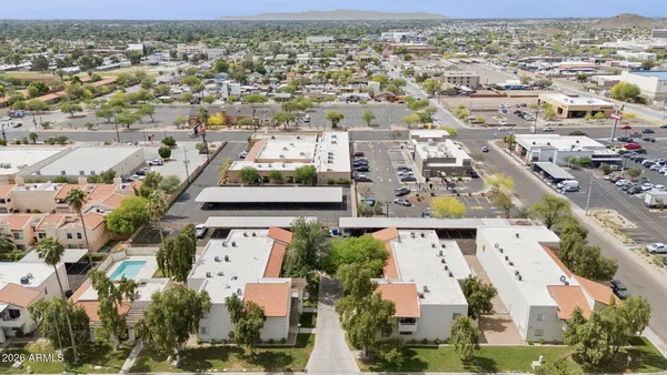 an aerial view of residential houses with outdoor space