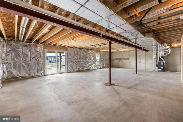 a view of empty room with wooden ceiling