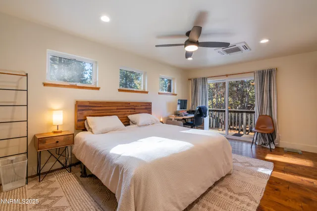 a bedroom with a large bed and a window