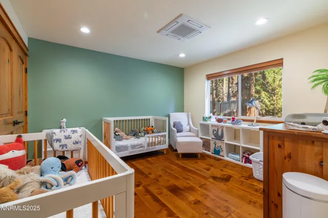 a bed room with furniture and a large window
