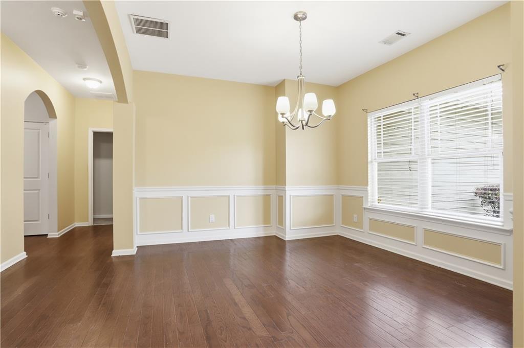 236 Manous Way Canton, GA 30115 - Photo 11 of 25 a view of empty room with wooden floor and fan