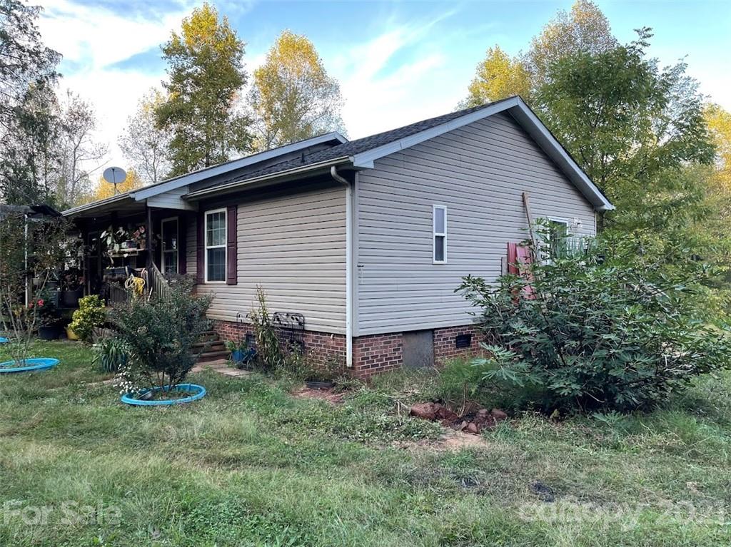 175 Balmy Lane Rutherfordton, NC 28139 - Photo 2 of 10 a view of a house with yard and a garden
