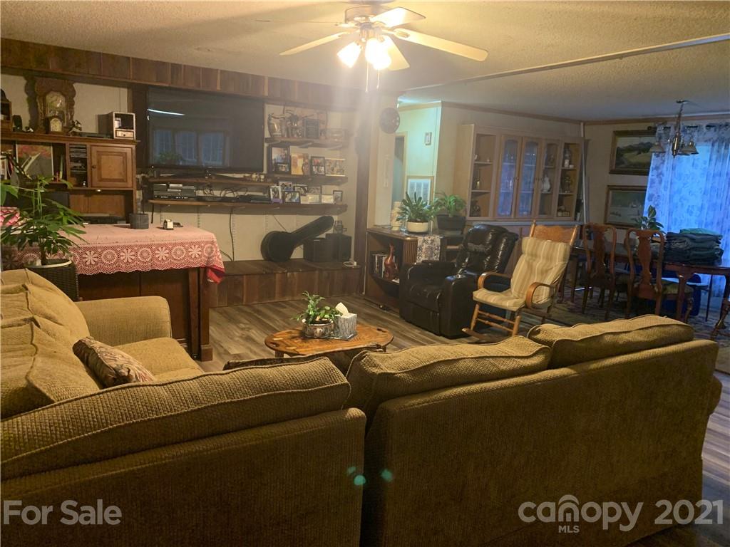 175 Balmy Lane Rutherfordton, NC 28139 - Photo 5 of 10 a living room with furniture and a chandelier