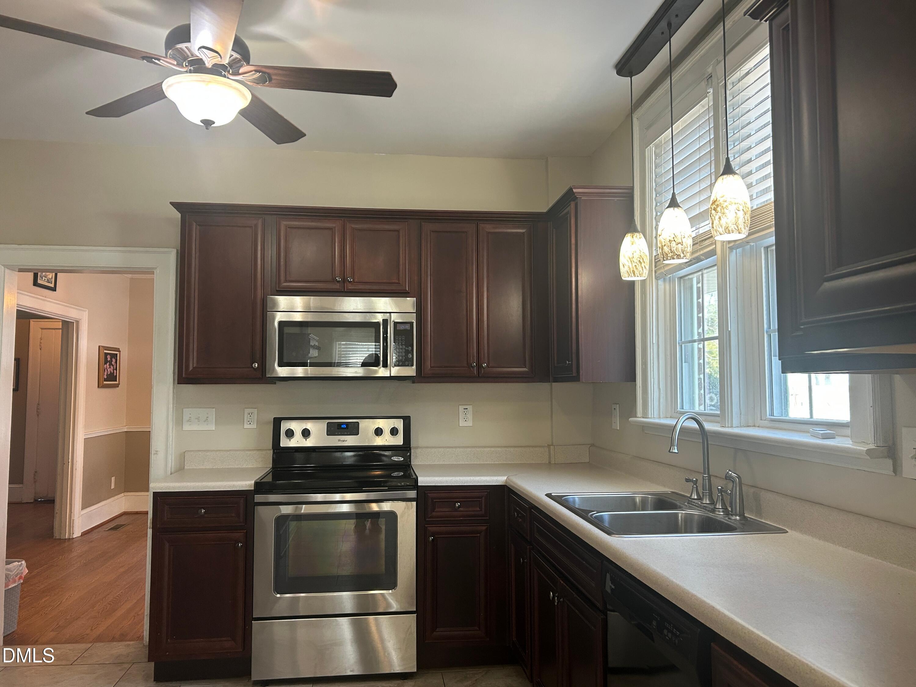 405 Sunset Avenue Clinton, NC 28328 - Photo 5 of 47 a kitchen with a stove and a sink