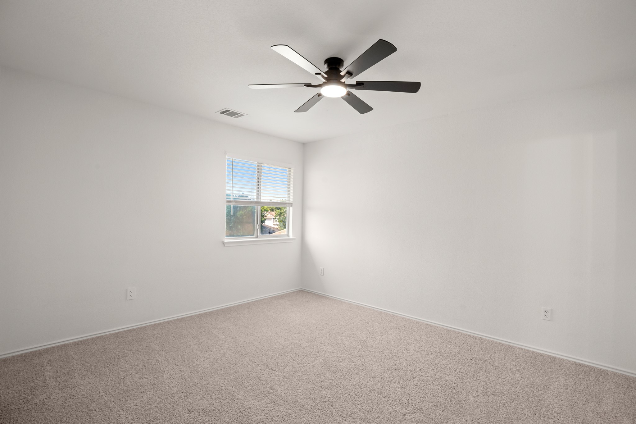 360 Sampson Kyle, TX 78640 - Photo 16 of 36 Bright room featuring neutral carpeting and white walls