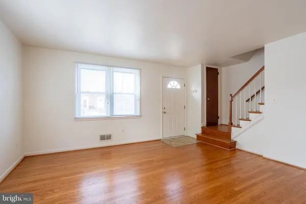 a view of entryway with wooden floor