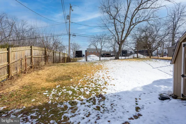 a view of a yard covered in snow