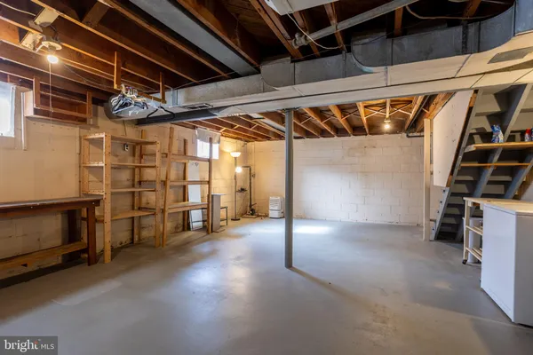 a view of an empty room with stairs