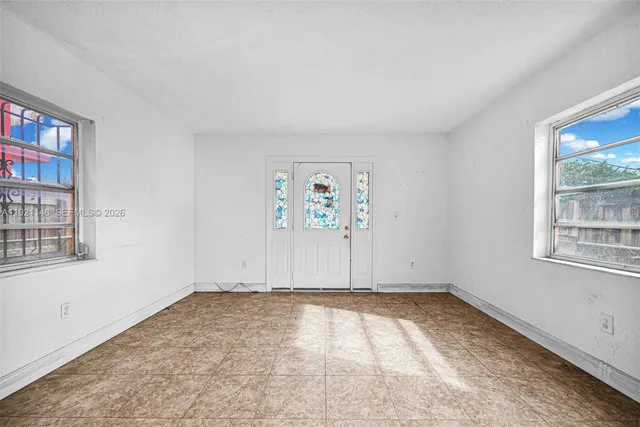 an empty room with windows