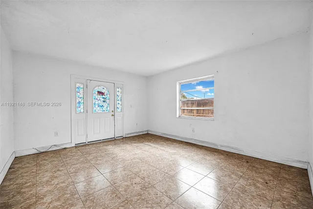 a view of an empty room with a window