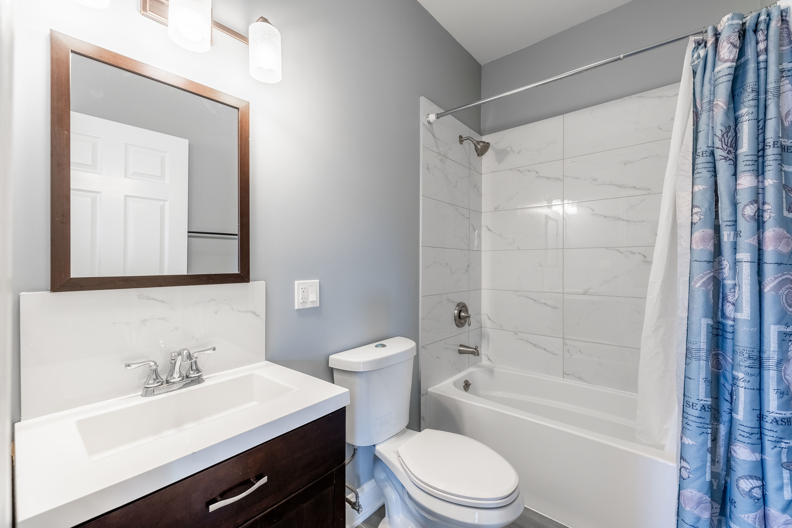4140 West Maypole Avenue, Unit 2 Chicago, IL 60624 - Photo 13 of 24 a bathroom with a sink a toilet and shower