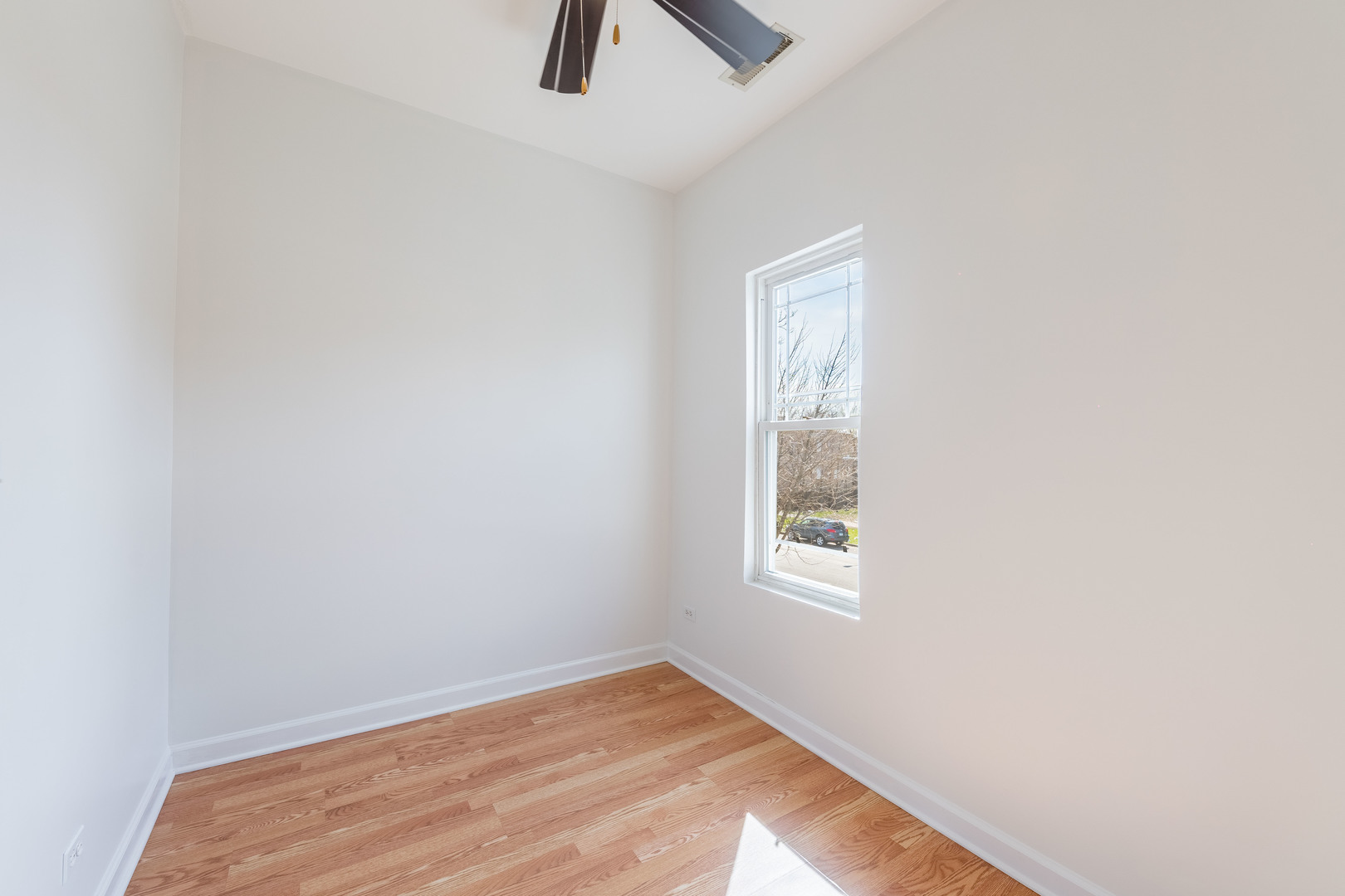4140 West Maypole Avenue, Unit 2 Chicago, IL 60624 - Photo 17 of 24 an empty room with closet and chandelier fan