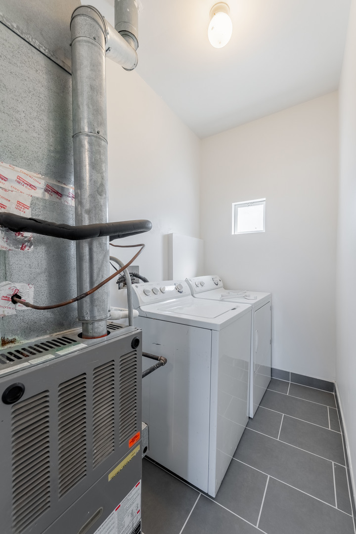4140 West Maypole Avenue, Unit 2 Chicago, IL 60624 - Photo 19 of 24 a utility room with dryer and washer