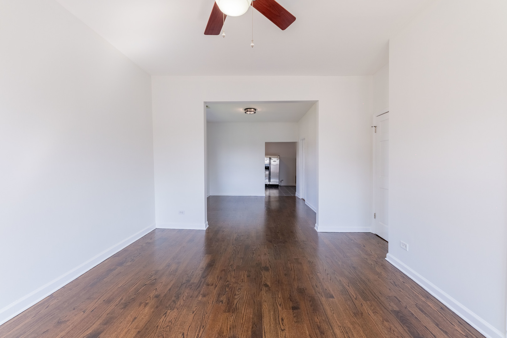 4140 West Maypole Avenue, Unit 2 Chicago, IL 60624 - Photo 4 of 24 a view of empty room with wooden floor