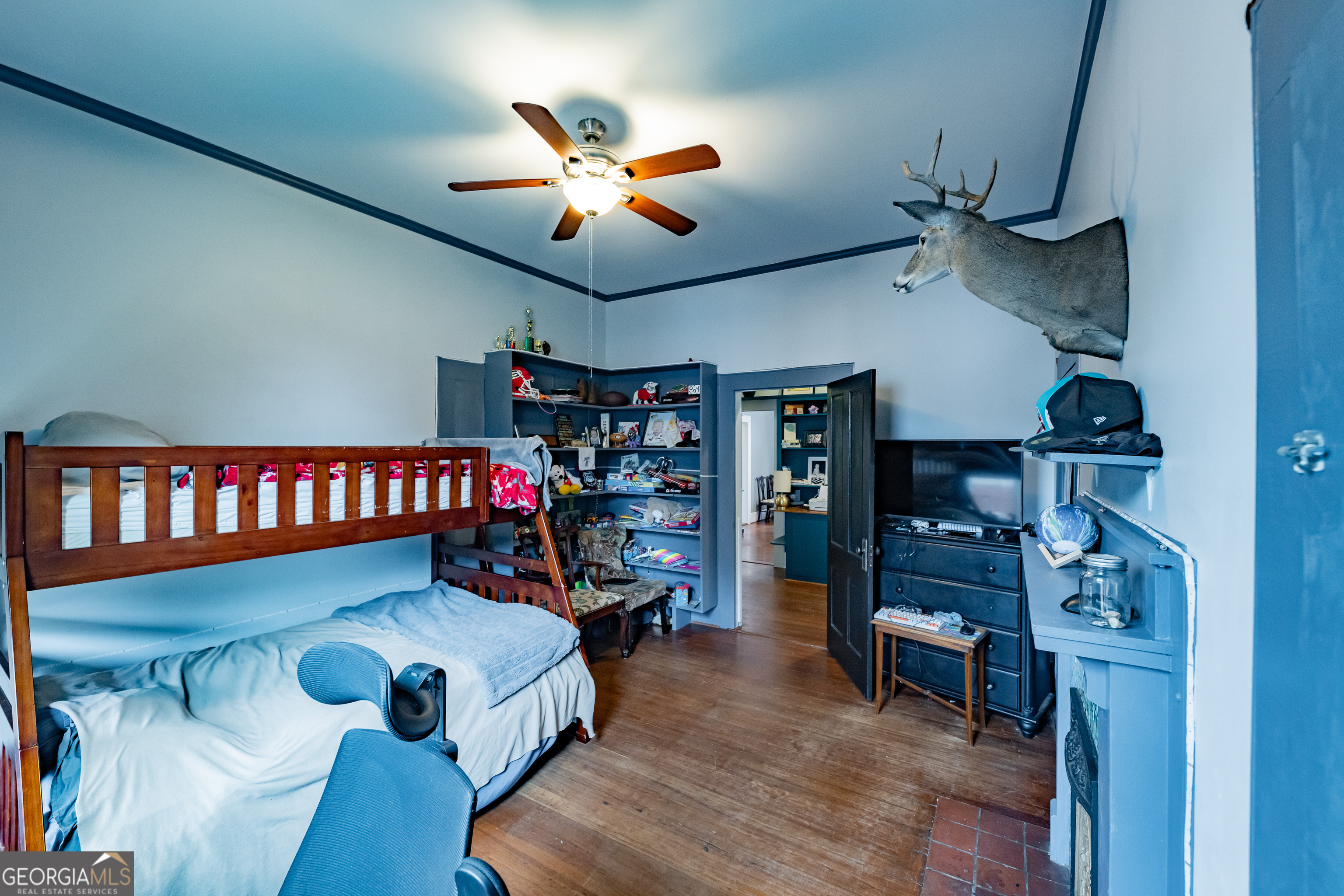 308 Howell Street Thomaston, GA 30286 - Photo 16 of 46 a bedroom with furniture and a chandelier