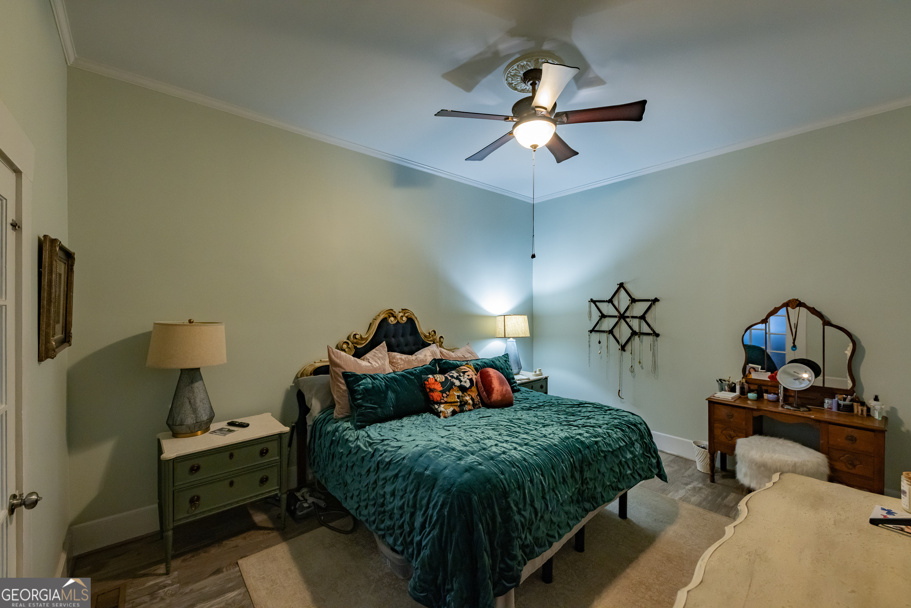308 Howell Street Thomaston, GA 30286 - Photo 22 of 46 a bedroom with a bed and a chandelier