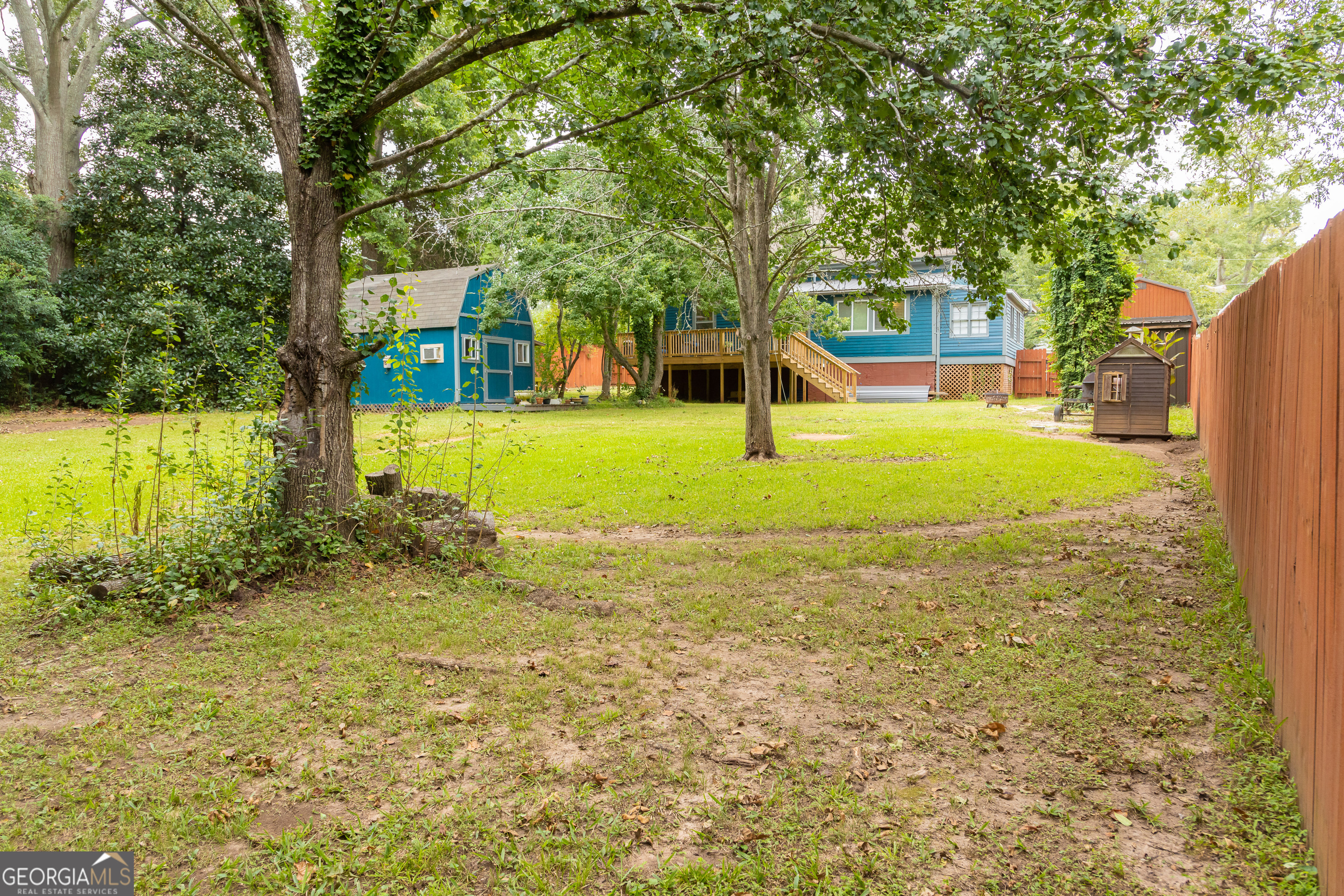 308 Howell Street Thomaston, GA 30286 - Photo 37 of 46 a view of a house with garden and trees
