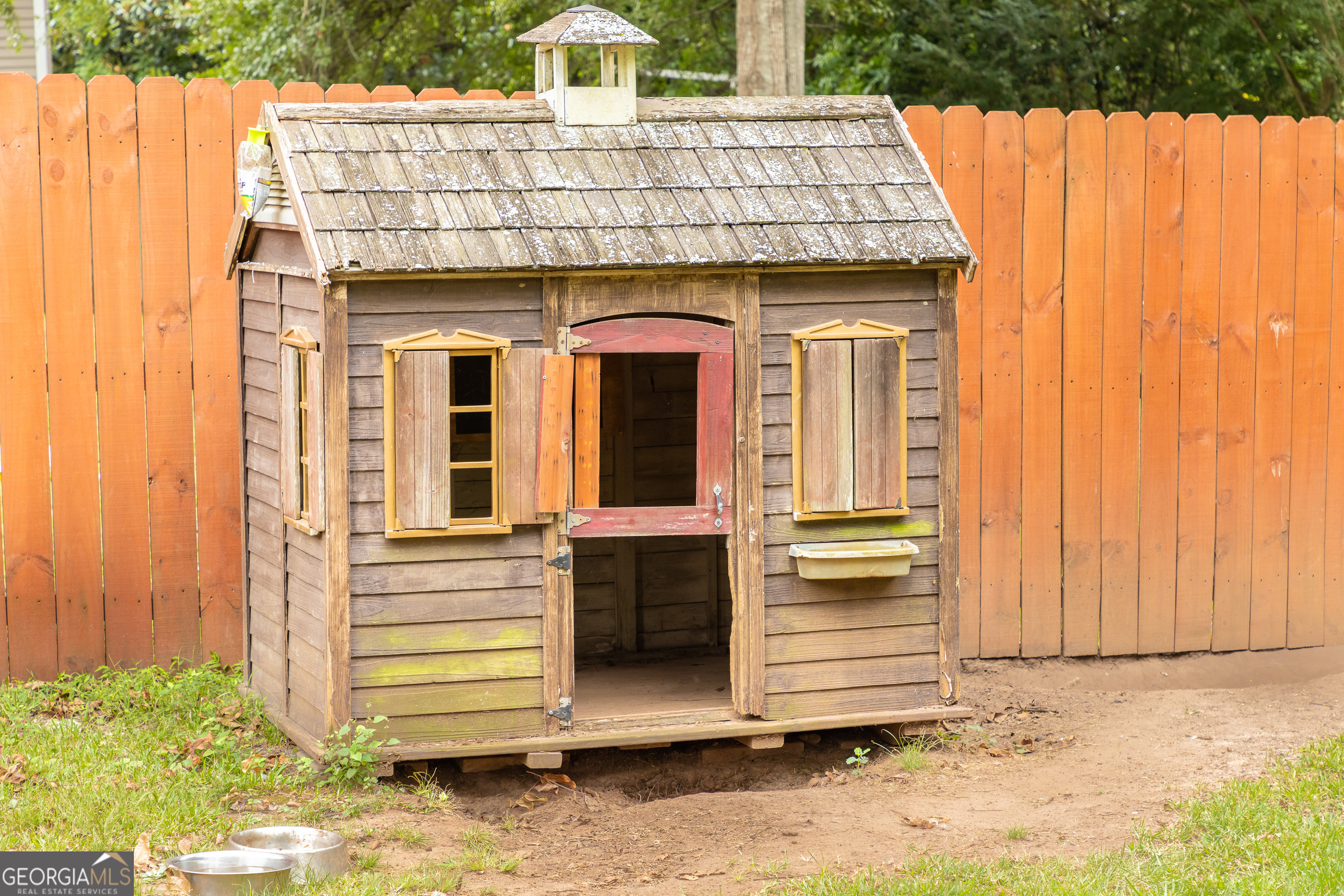 308 Howell Street Thomaston, GA 30286 - Photo 38 of 46 a view of a house with a door and wooden walls