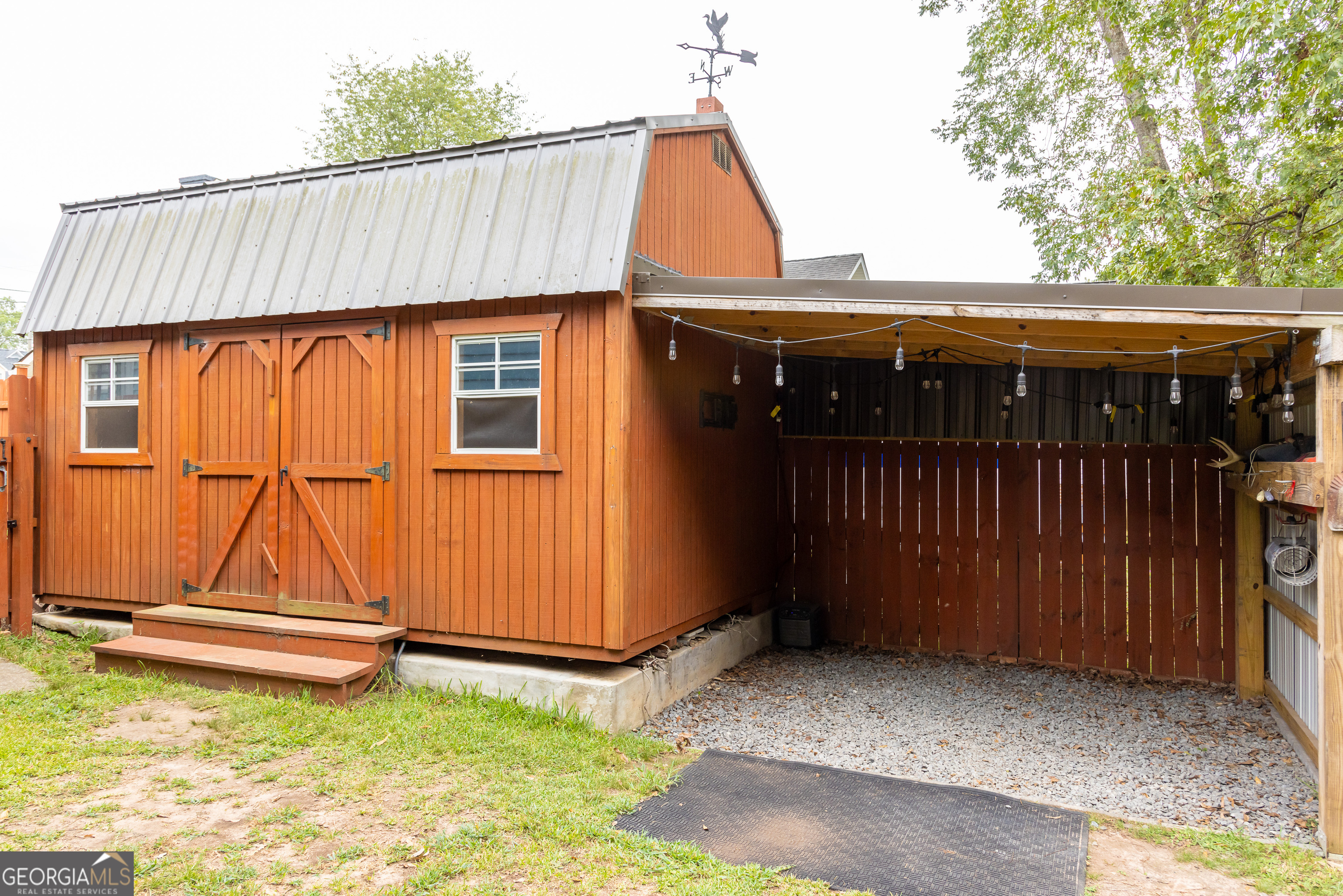 308 Howell Street Thomaston, GA 30286 - Photo 40 of 46 a backyard of a house wit a car park