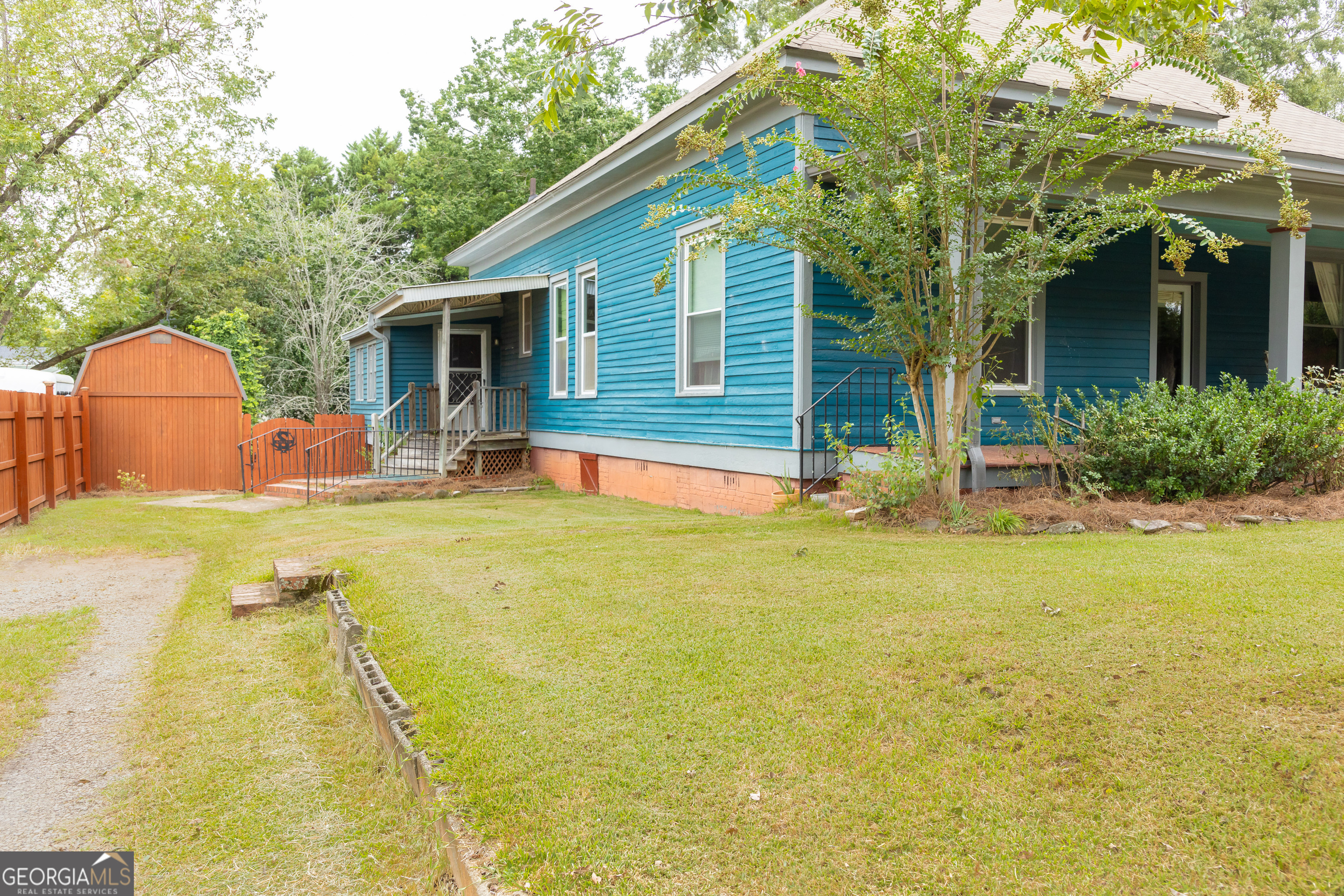 308 Howell Street Thomaston, GA 30286 - Photo 43 of 46 a house view with swimming pool in front of it