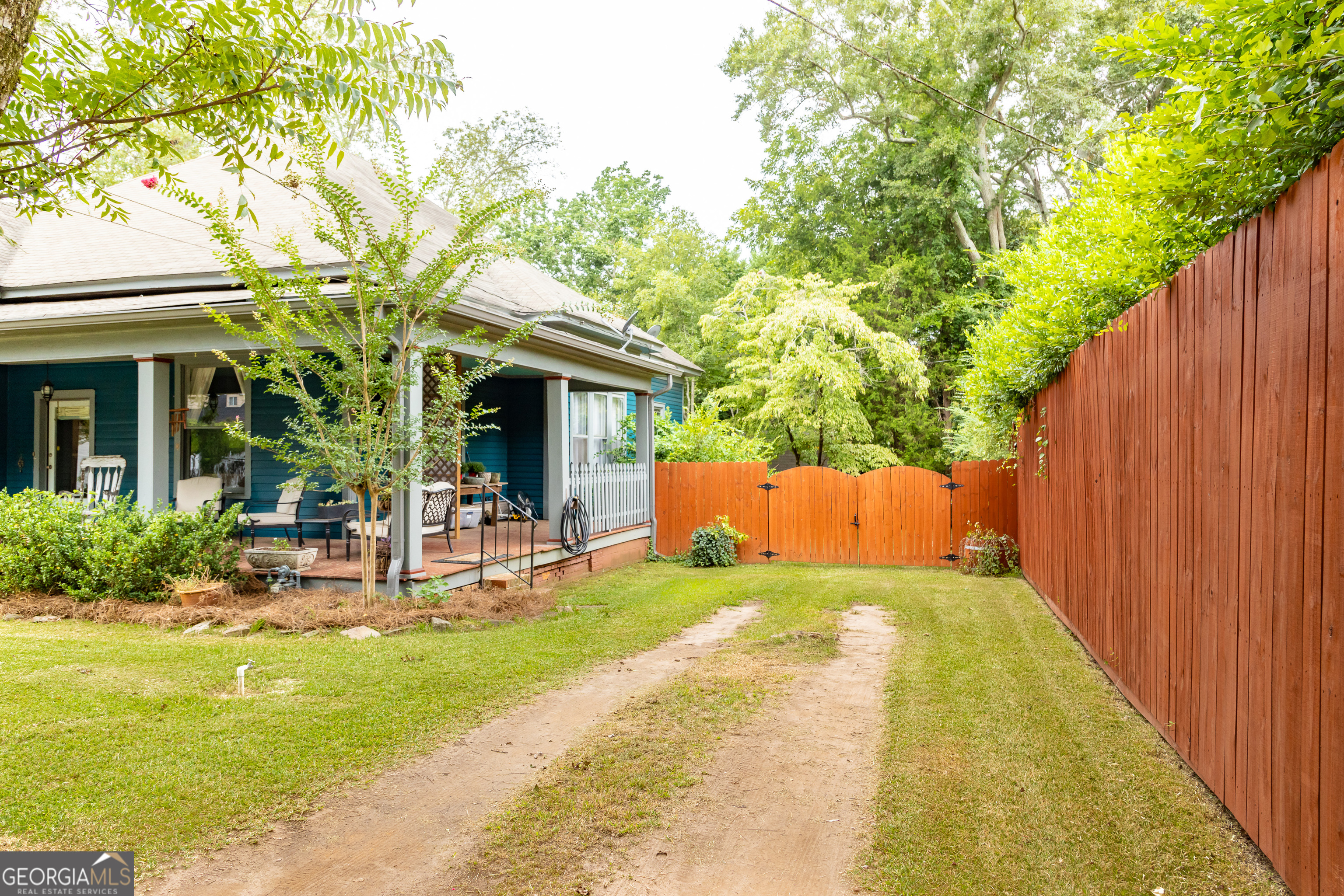 308 Howell Street Thomaston, GA 30286 - Photo 45 of 46 a front view of a house with garden and patio
