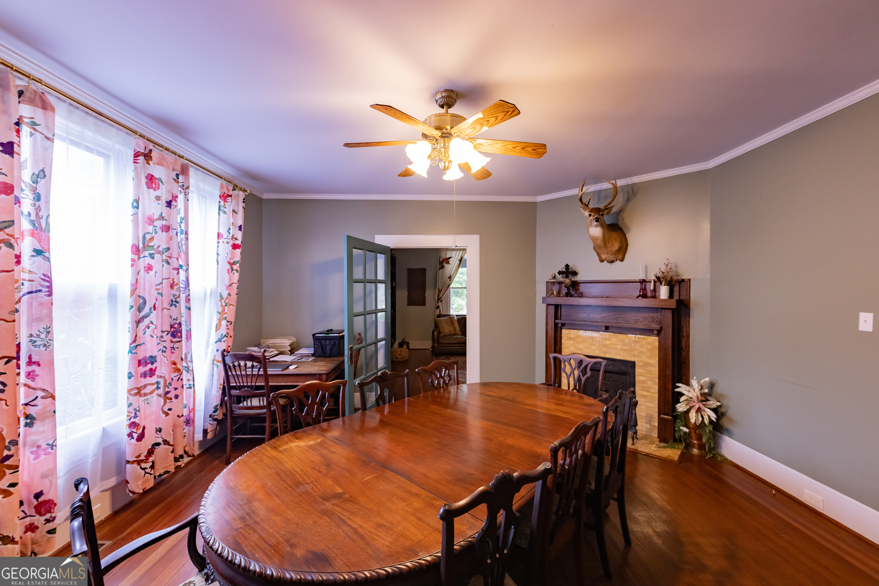 308 Howell Street Thomaston, GA 30286 - Photo 8 of 46 a view of a dining room with furniture and wooden floor