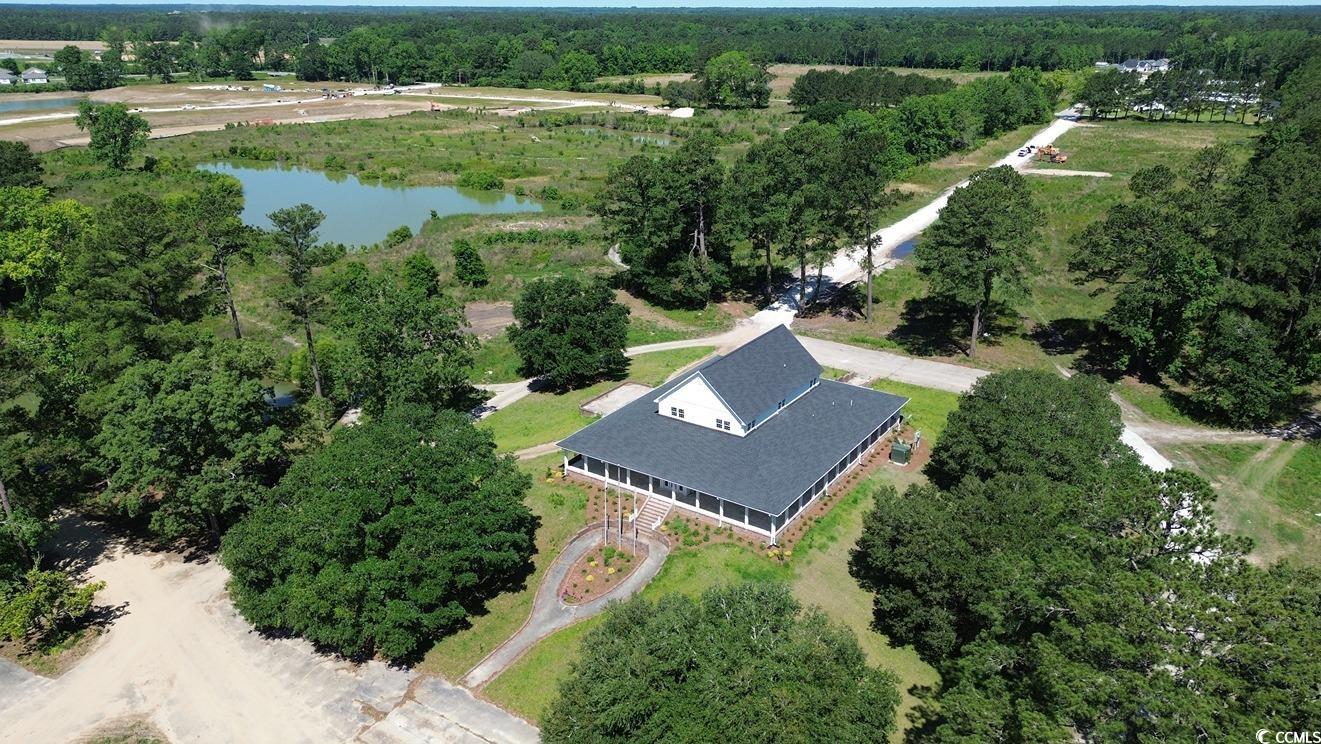 299 Long Beard Way Loris, SC 29569 - Photo 27 of 37 Drone / aerial view of a large body of water and a heavily wooded area