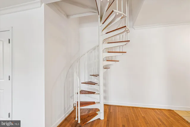 a view of a kitchen with wooden floor