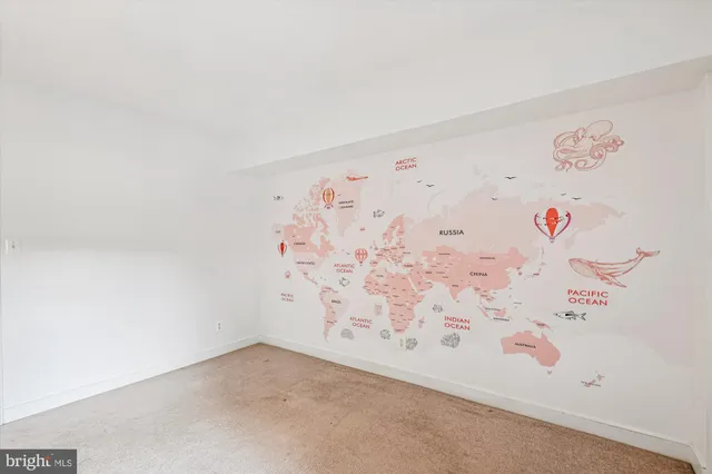 a picture of a bench in front of a wall