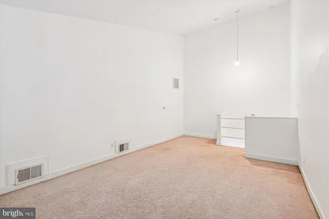 a view of a patio with couches and a fire pit