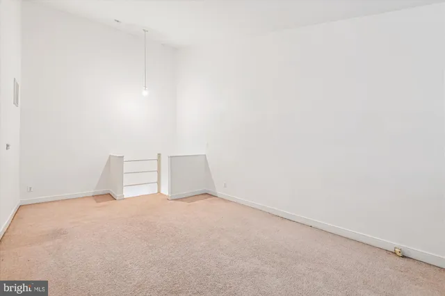 a view of a patio with a dining table and chairs with wooden floor and fence