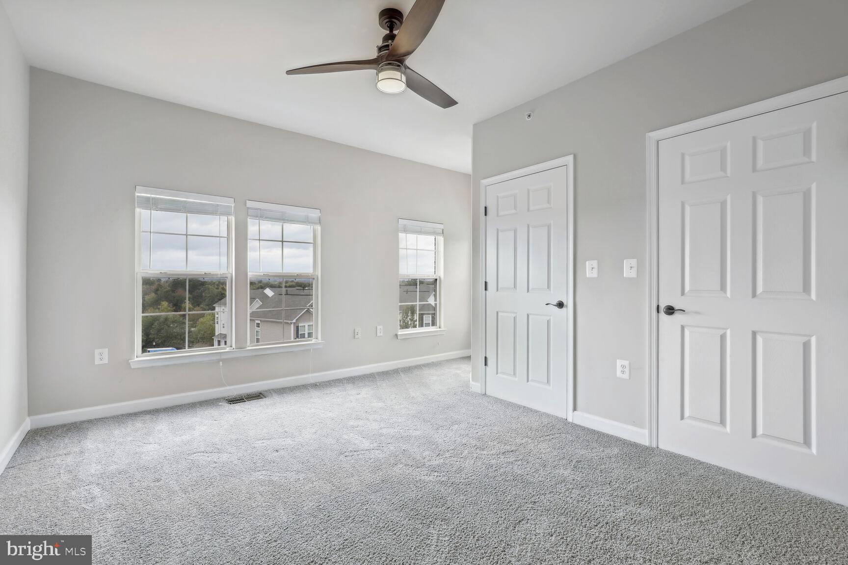 42379 Goldenseal Square Brambleton, VA 20148 - Photo 13 of 20 an empty room with windows and entrance