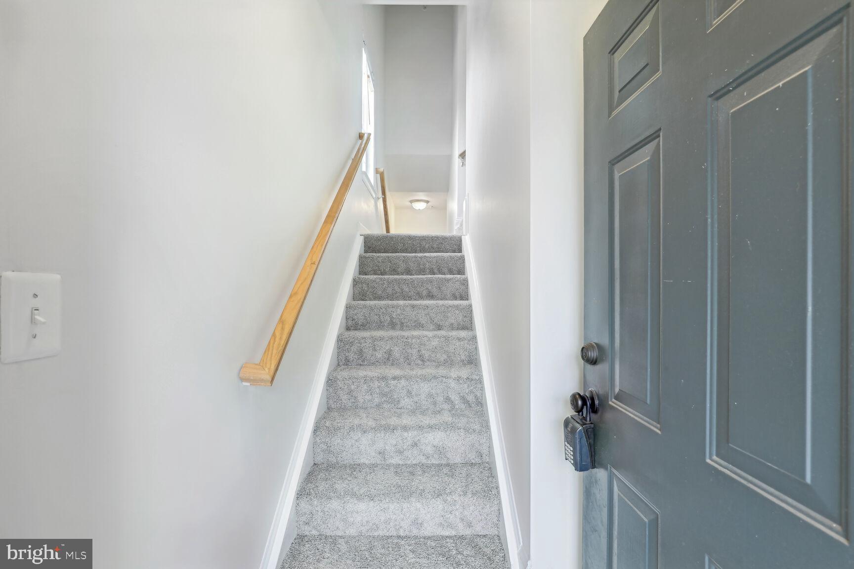 42379 Goldenseal Square Brambleton, VA 20148 - Photo 4 of 20 a view of staircase with white walls