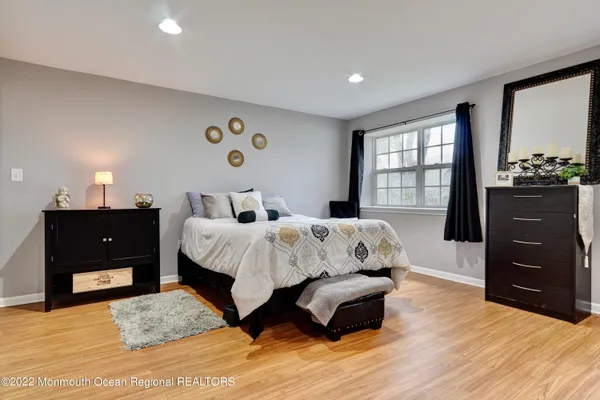 a bed room with a bed and a dresser