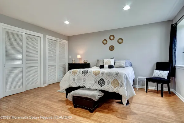 a bedroom with a bed and a lamp